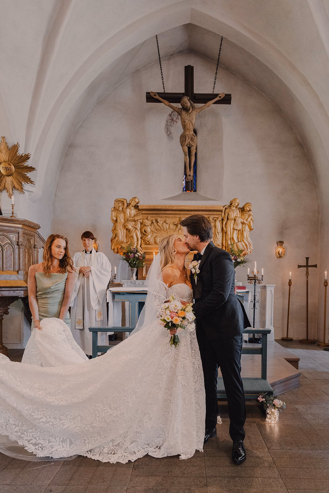 Bride and groom standing together at a church altar