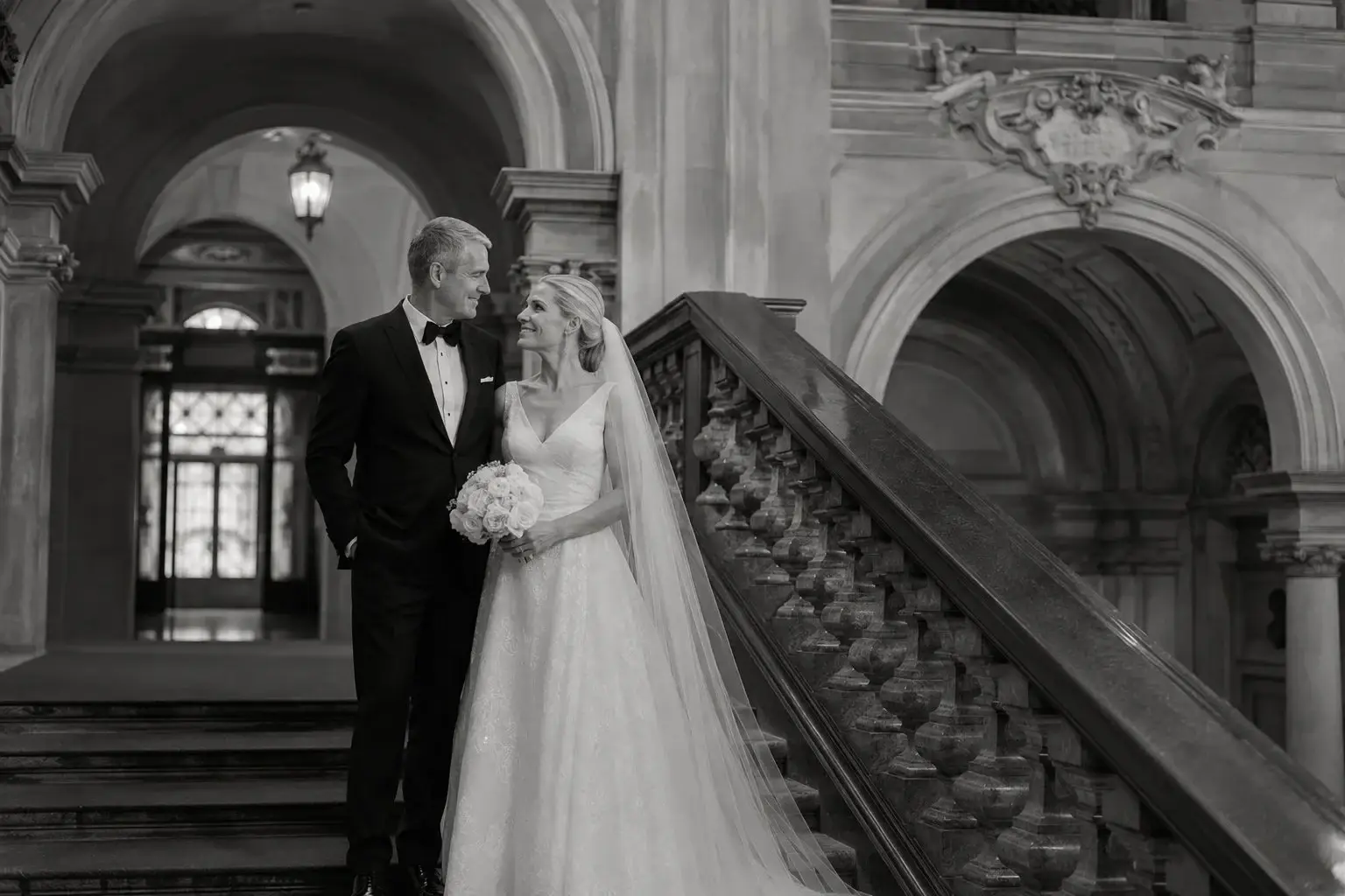 Black-and-white portrait of a bride on the staircase at Villa Erba.
