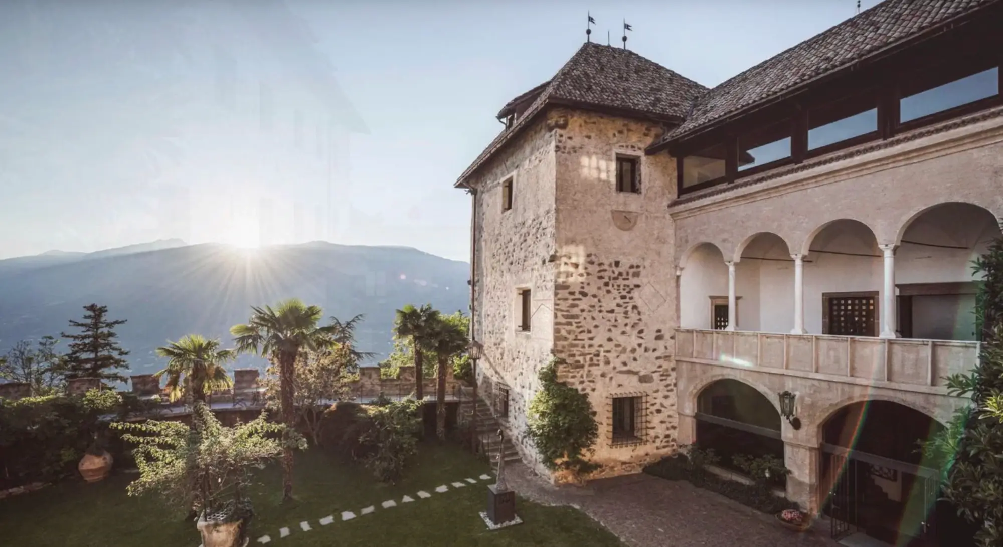 Historic stone villa overlooking a mountain valley.