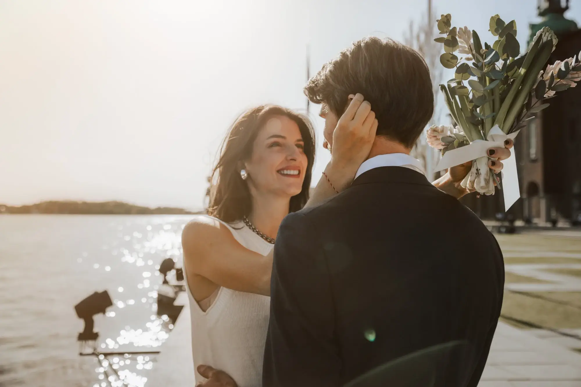 Couple smiling together on the Stockholm waterfront.