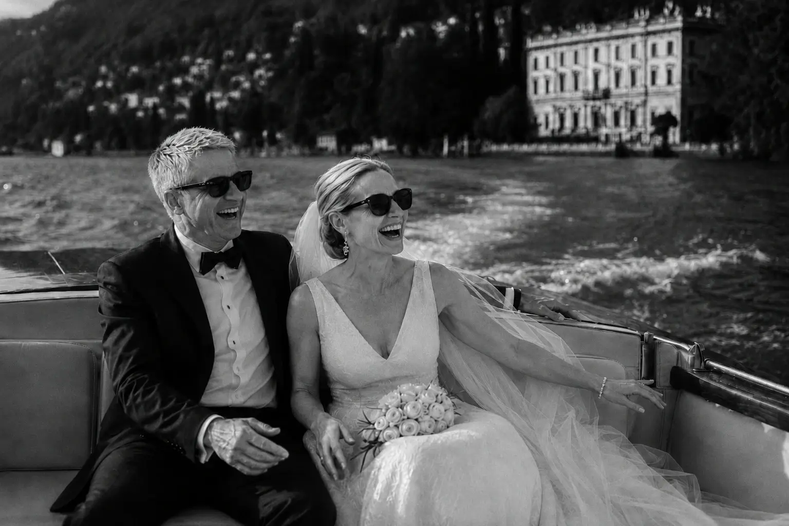 Black-and-white portrait of newlyweds on a boat on Lake Como.