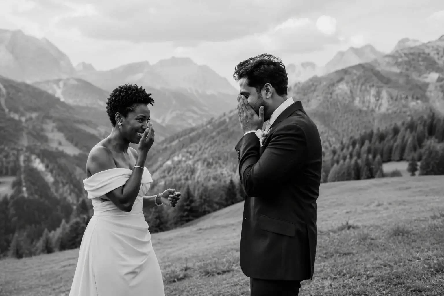 Bride and groom sharing an emotional first look in the Dolomites before their intimate mountain wedding ceremony.
