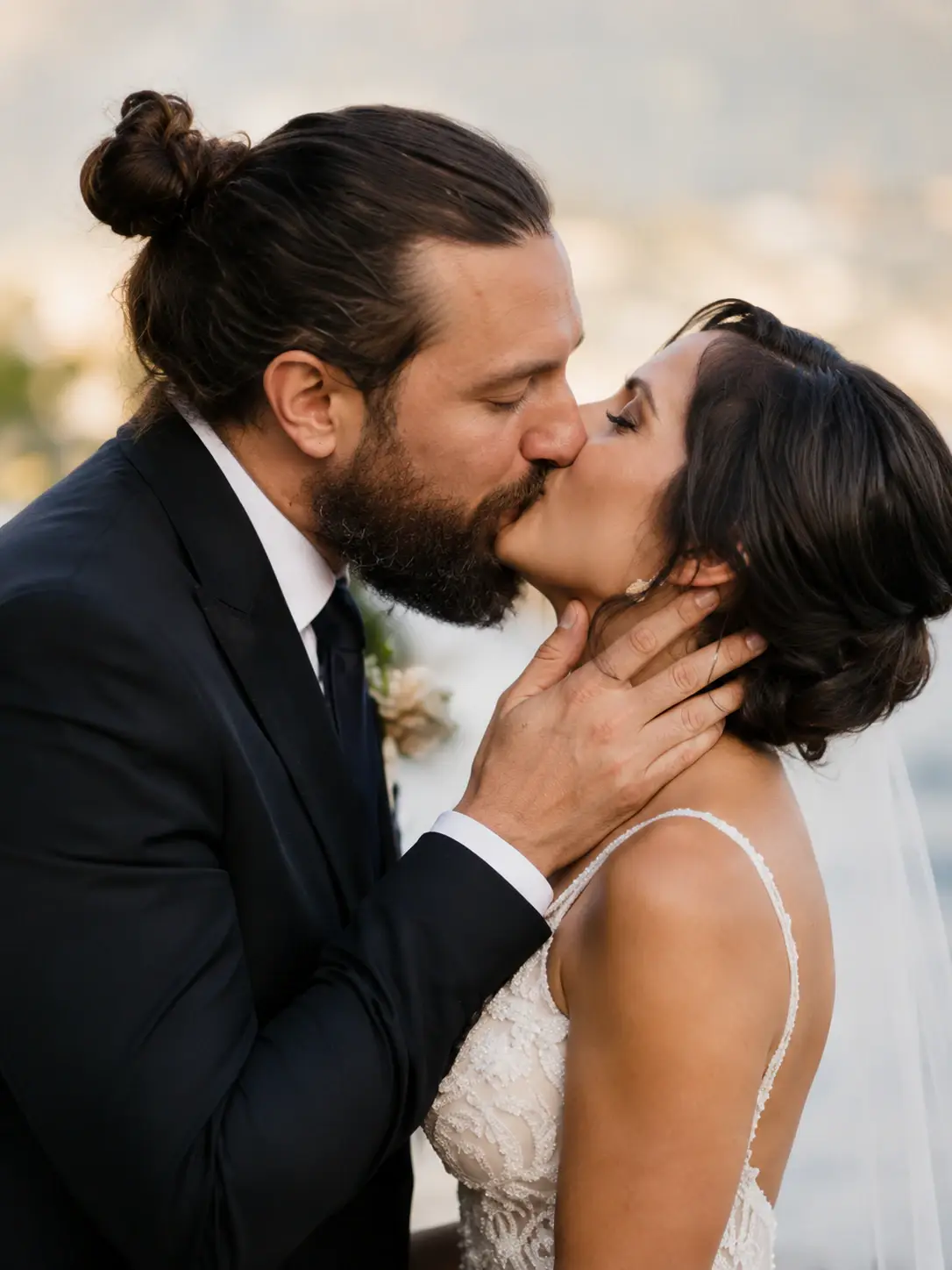 Grand Hotel Tremezzo wedding couple kissing during golden hour portrait session on Lake Como with cinematic documentary style and elegant Italian villa atmosphere