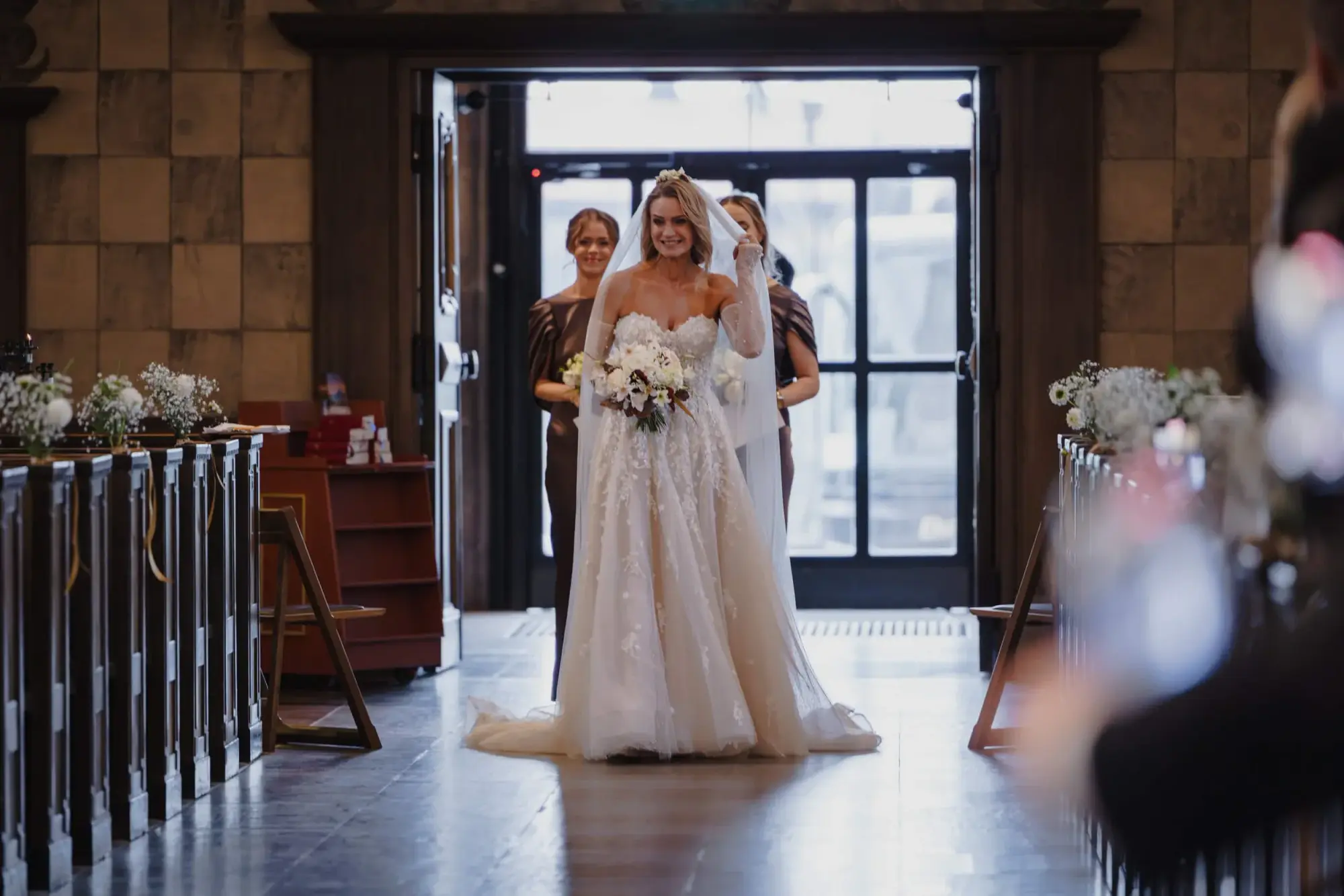 Vanessa walking down the aisle during her wedding ceremony at Högalidskyrkan in Stockholm