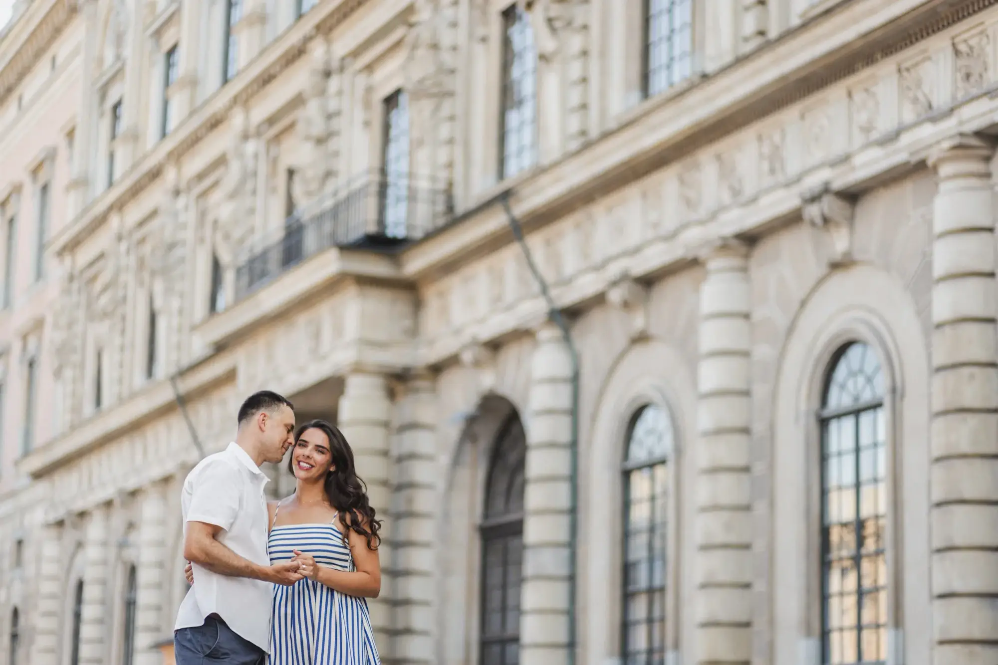 Couple standing outside Stockholm City Hall.