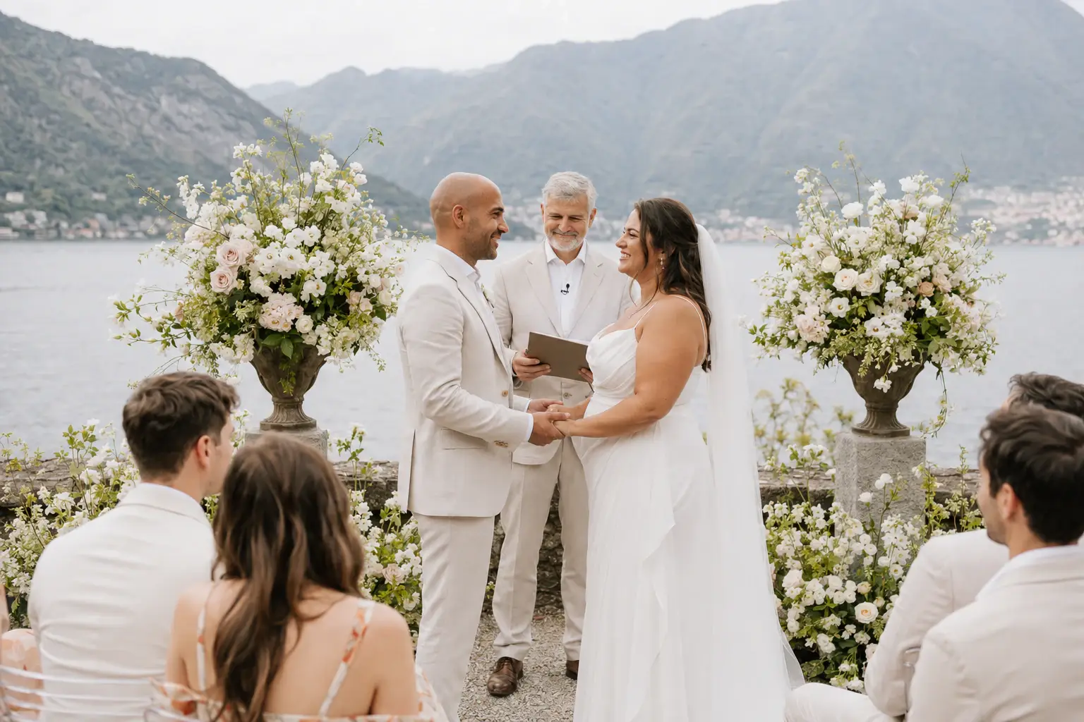 Officiant speaking to a couple during a Lake Como ceremony.