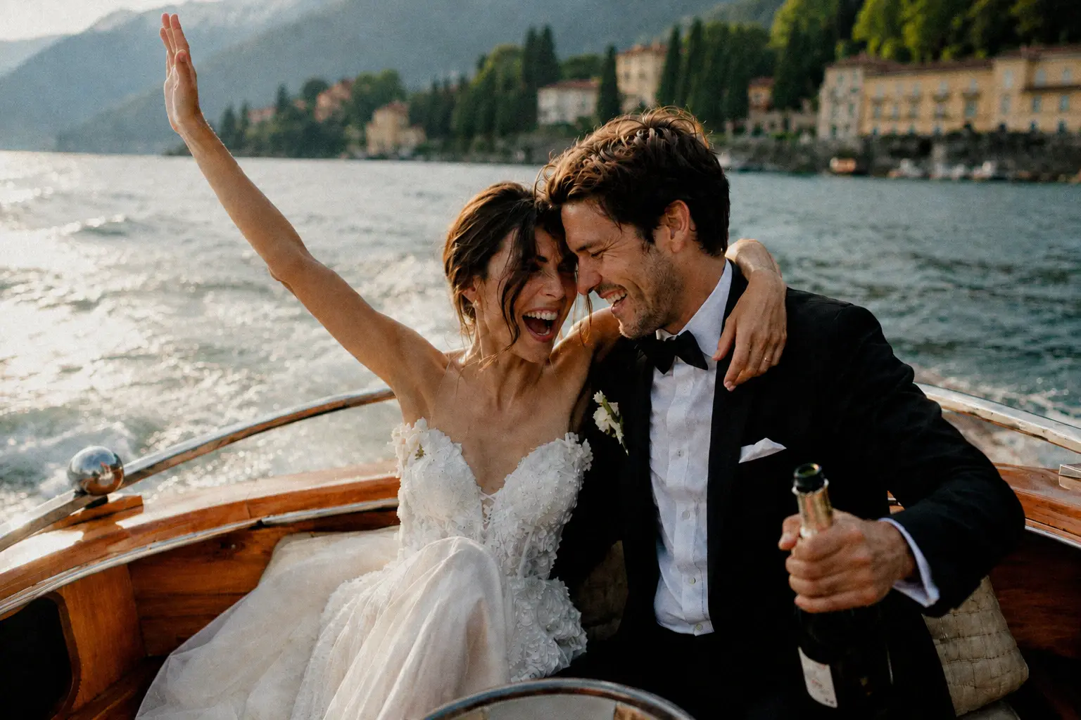 Newlyweds celebrating together on a wooden boat on Lake Como.