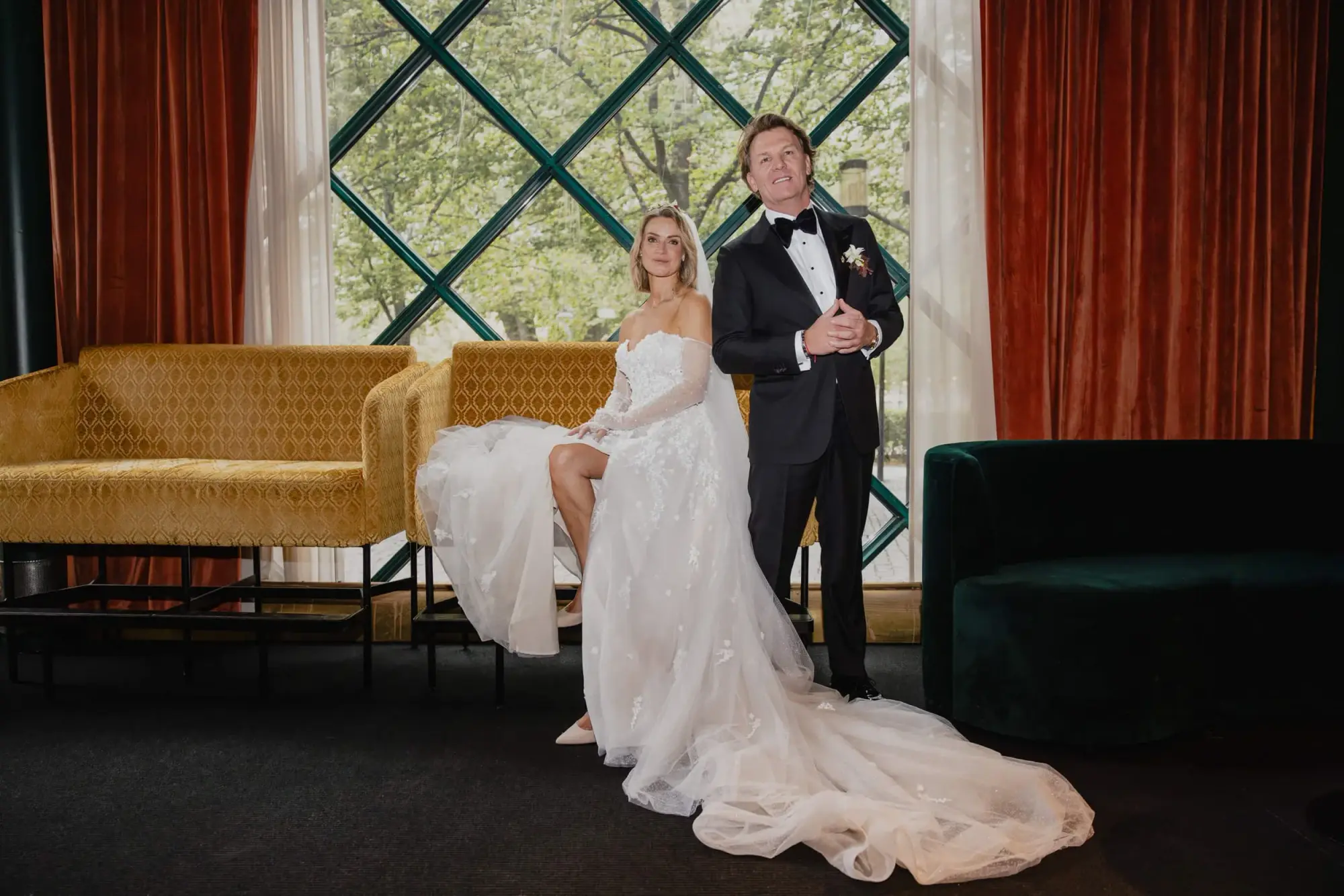 Couple beside the geometric window during a ten-minute Café Opera portrait session