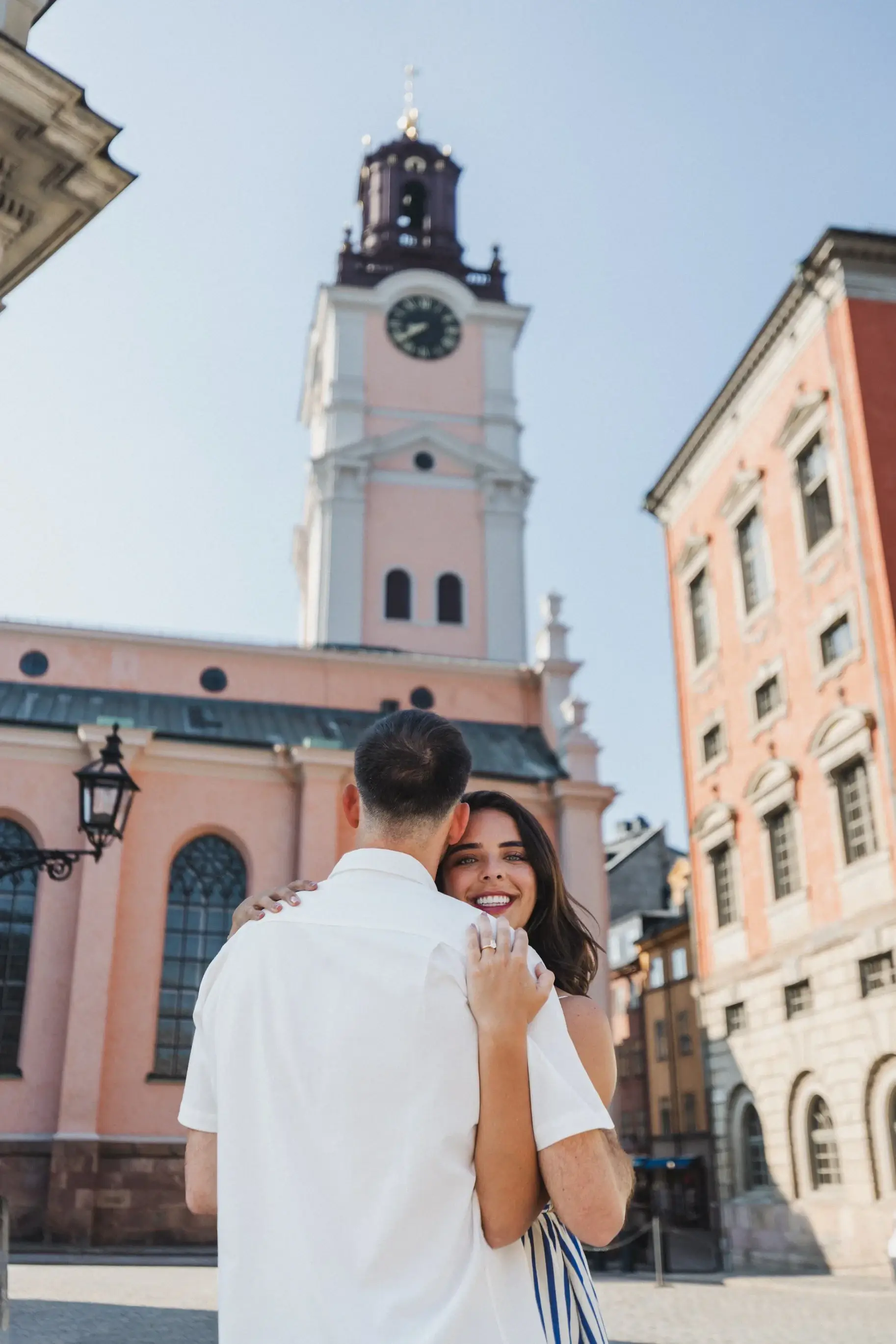 Couple walking toward a square in Stockholm.
