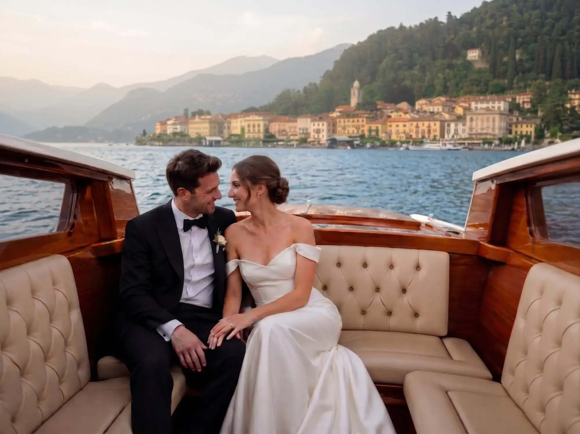 Bride and groom on a classic wooden boat with Bellagio views on Lake Como, cinematic destination wedding photography in Northern Italy