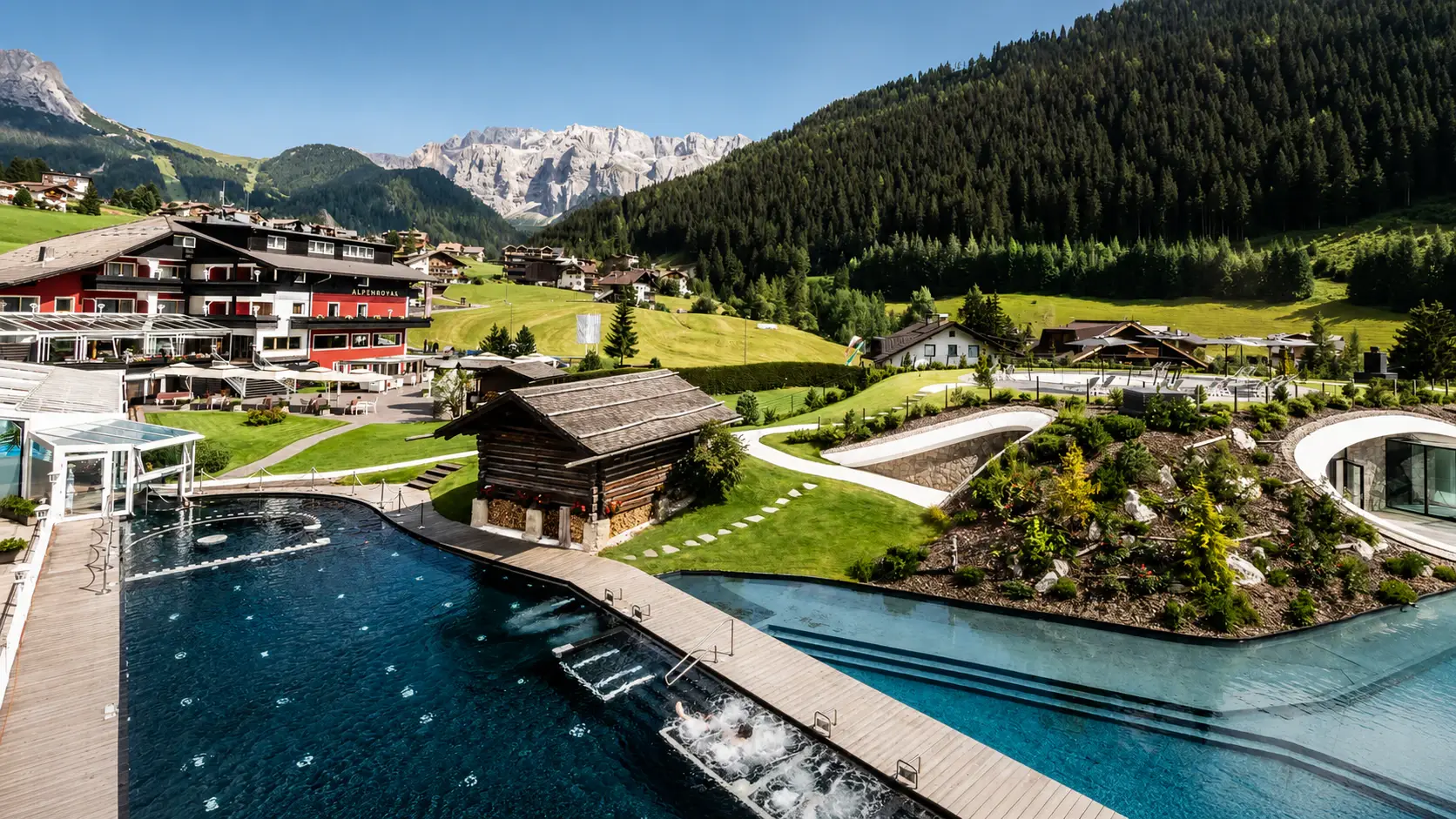 Mountain resort with an outdoor pool and alpine views.