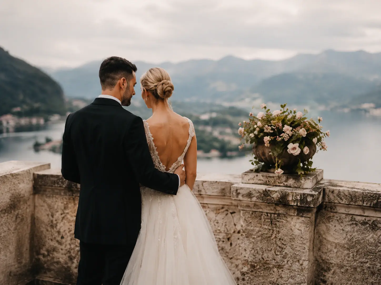 Bride and groom overlooking an Italian lake during destination wedding portraits