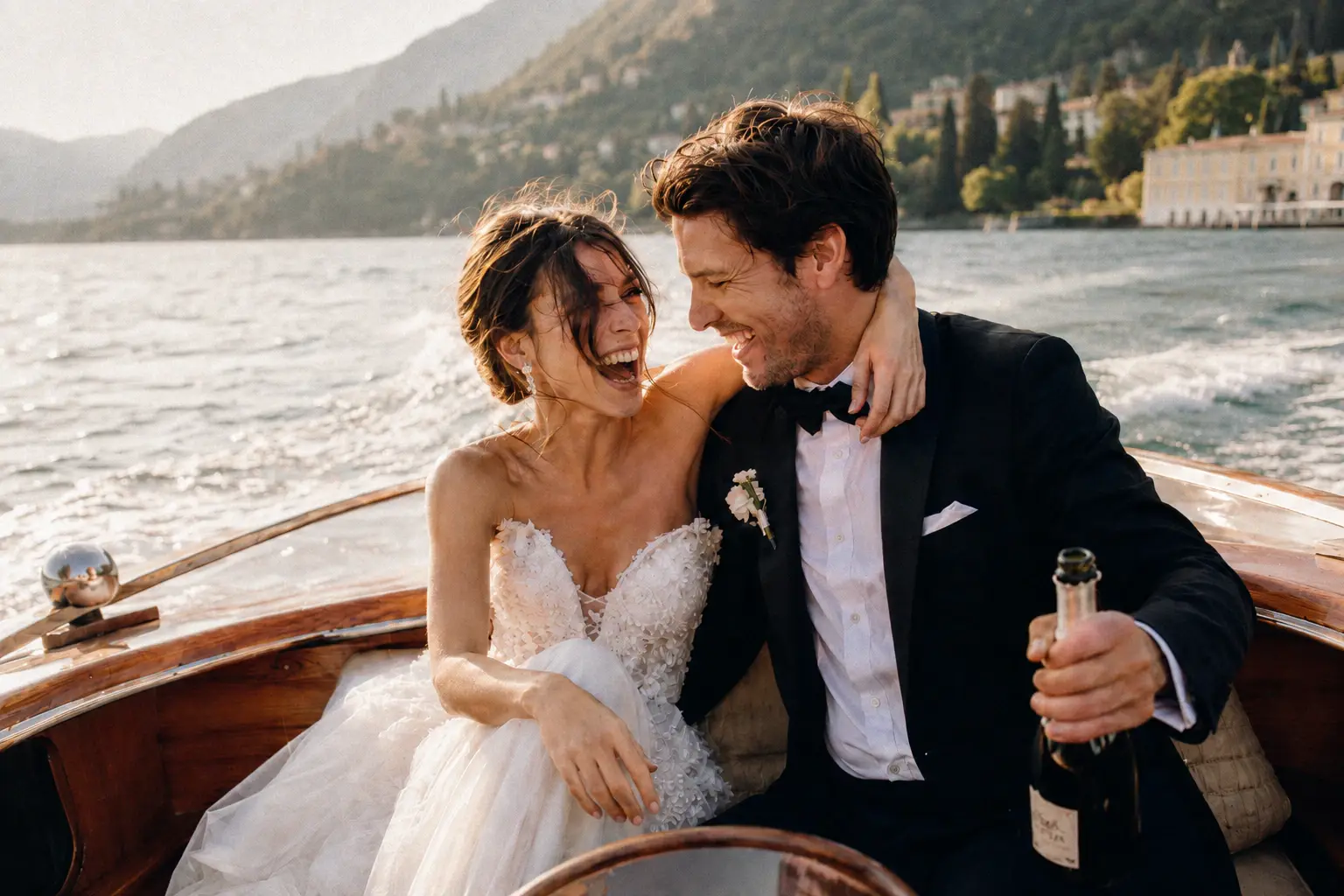 Newlyweds celebrating with champagne on a wooden boat.