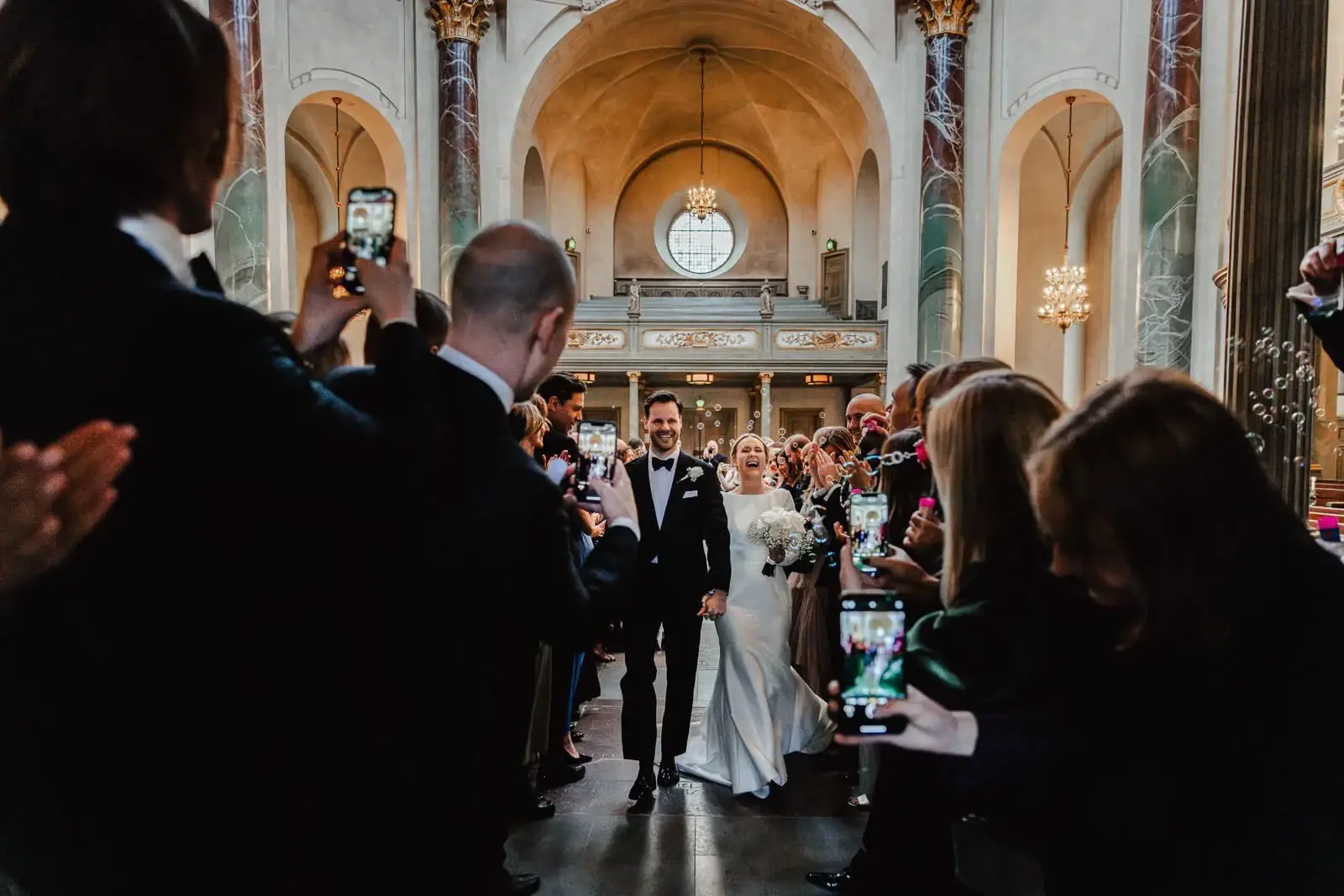 Couple standing at the altar during a church ceremony.
